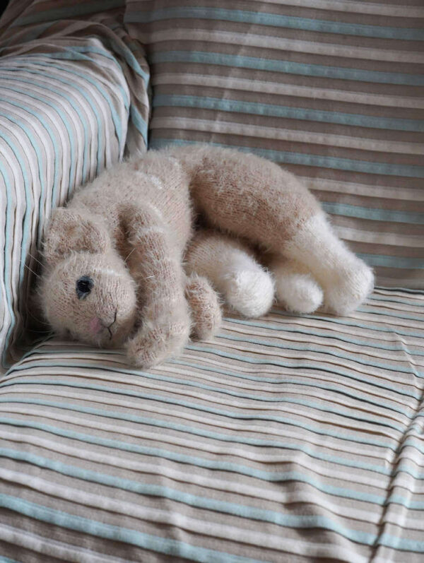 OriLari Sandy Cat lies on a chair